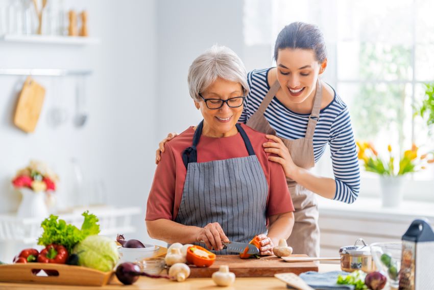 Mom and Daughter Cooking Healthy Food